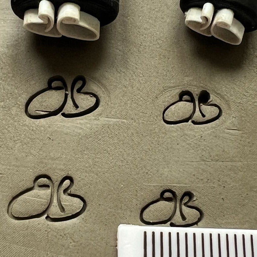 Pottery stamp with a BB design for custom clay impressions