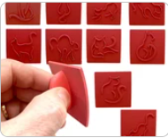 Featuring cat character stamps for creating playful pottery impressions.