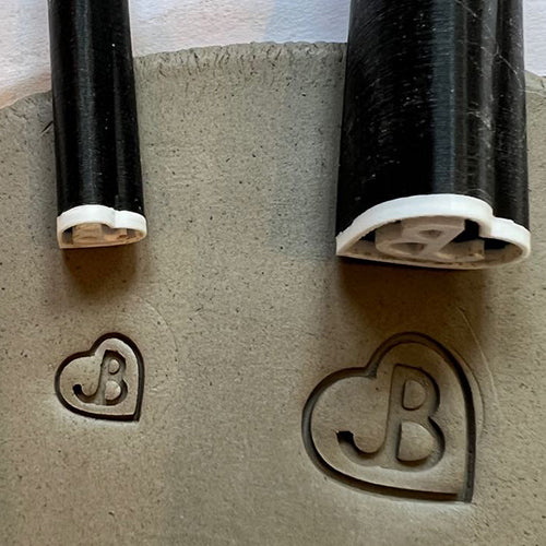Custom pottery mark stamp for personalized and branded impressions on clay.