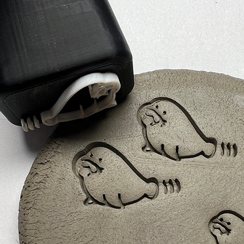 Walrus-themed custom potter’s mark stamp for adding personalized touches to ceramics.
