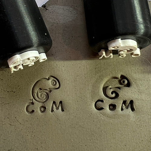 Custom potter’s mark stamp featuring a circular Pottery.com logo for ceramic branding