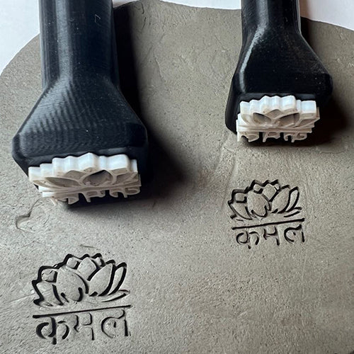 Pottery stamp with a custom flower design for unique clay impressions.