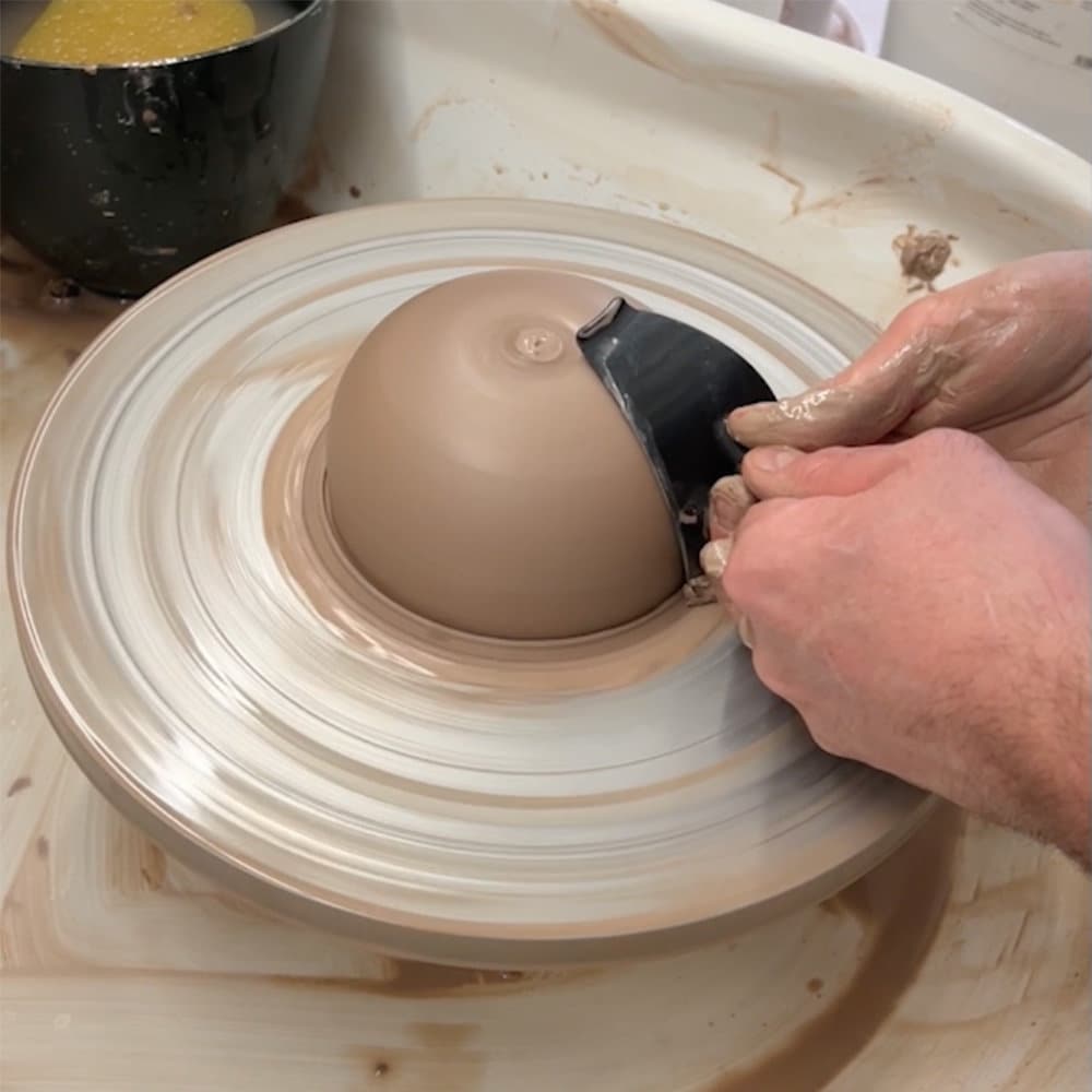 Pottr clay centering aid for assisting potters in centering clay on the wheel.