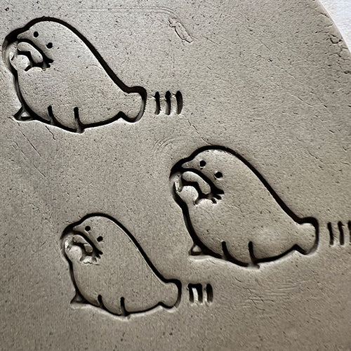 Walrus pottery stamp for adding a playful animal motif to ceramic pieces.