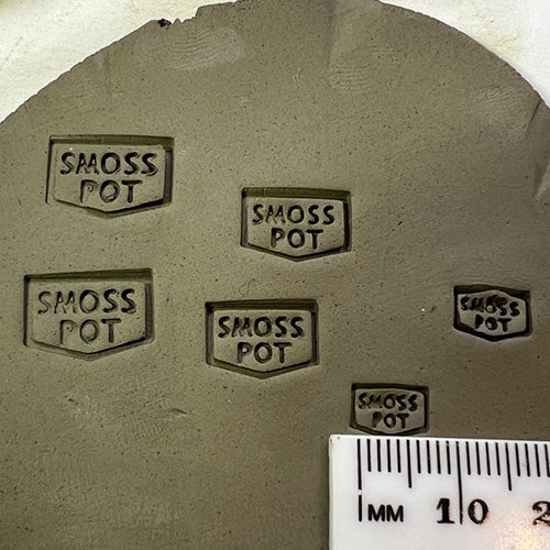 Pottery stamp with a moss design for creating natural-inspired impressions.